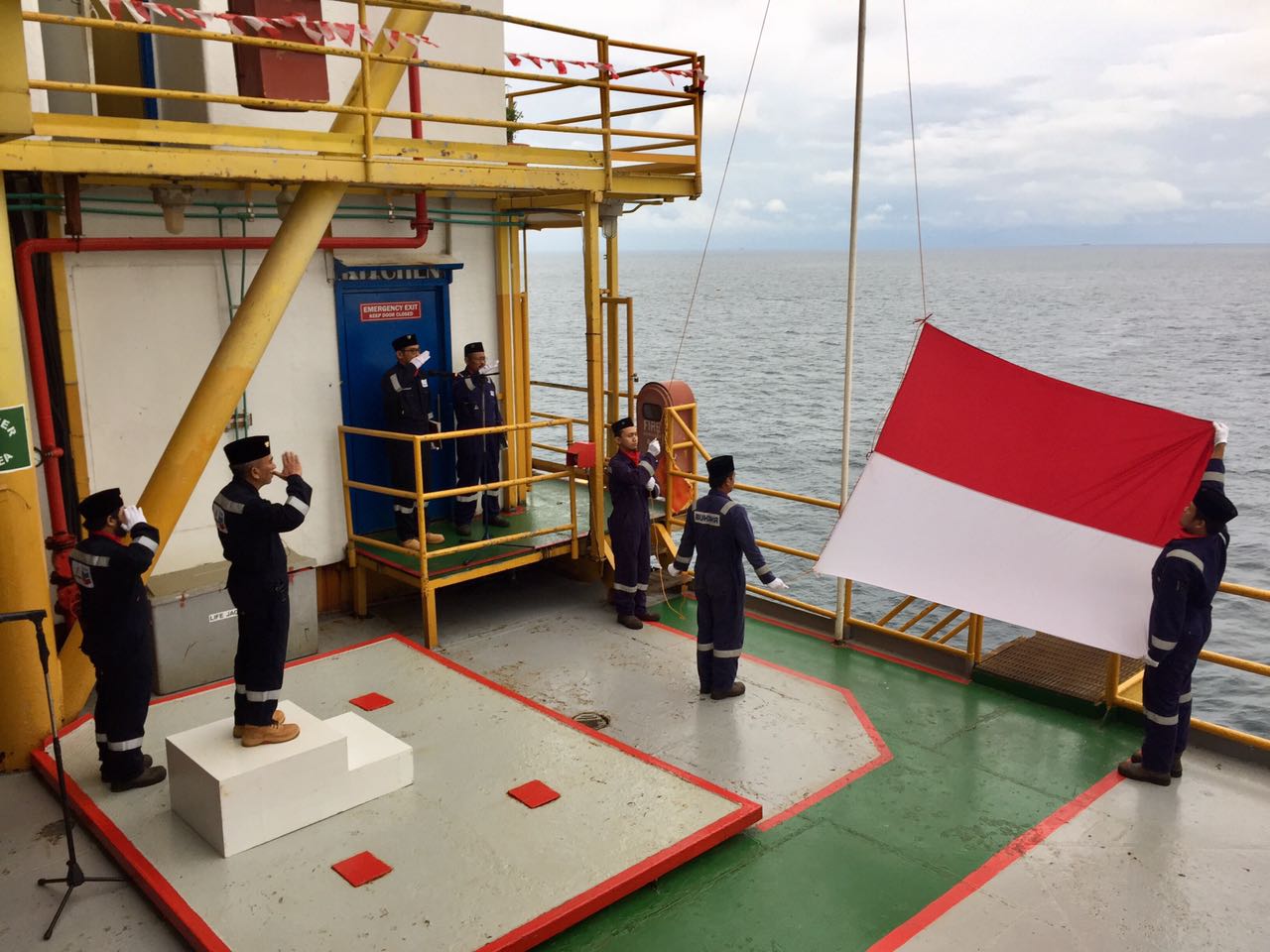 Person hoisting a flag